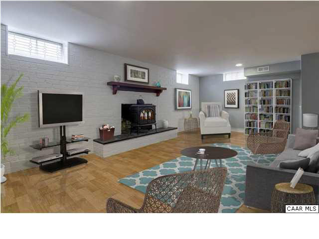 1144 Meriwether Street Charlottesville, VA 22902 - Photo 14 of 18 a living room with furniture and a fireplace