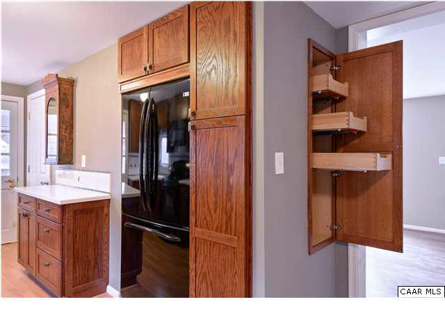 1144 Meriwether Street Charlottesville, VA 22902 - Photo 3 of 18 a kitchen with stainless steel appliances kitchen island granite countertop a refrigerator and cabinets