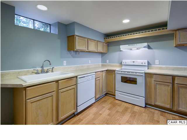 1144 Meriwether Street Charlottesville, VA 22902 - Photo 10 of 18 a kitchen with a sink stove and cabinets