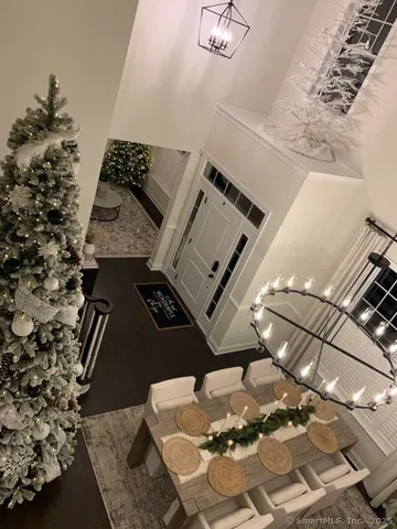 a bedroom with two beds and painting on the wall