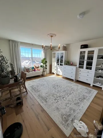 a bedroom with bed and window