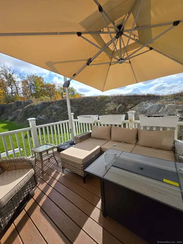 a view of a patio with couches and pool