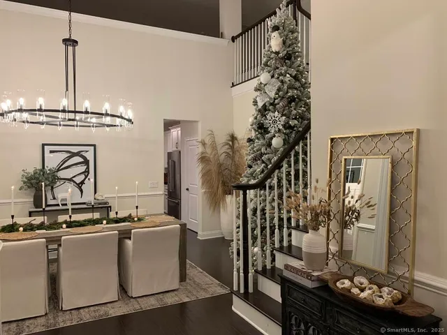 a living room with furniture and a chandelier