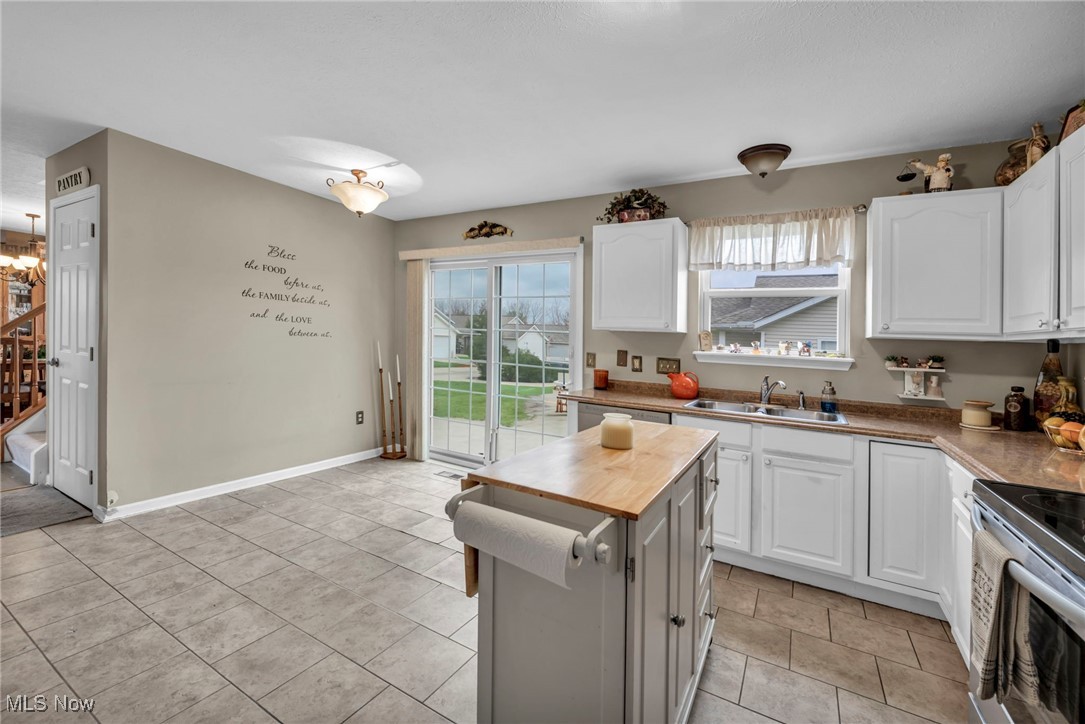 3887 Reeves Lane Medina, OH 44256 - Photo 20 of 42 Kitchen featuring butcher block countertops, sink, and white cabinets