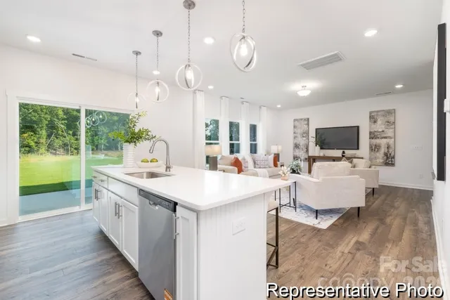a large kitchen with stainless steel appliances kitchen island a large island in the center