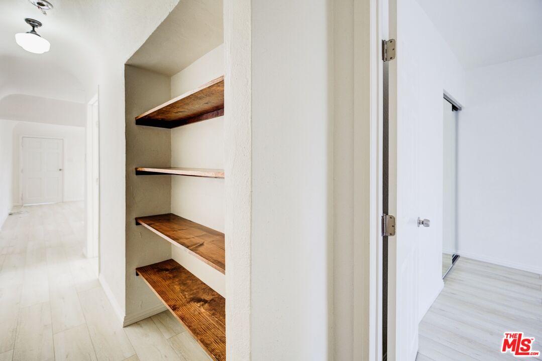 3659 6th Avenue, Unit 3661 1/2 Los Angeles, CA 90018 - Photo 16 of 23 a view of front door with wooden floor