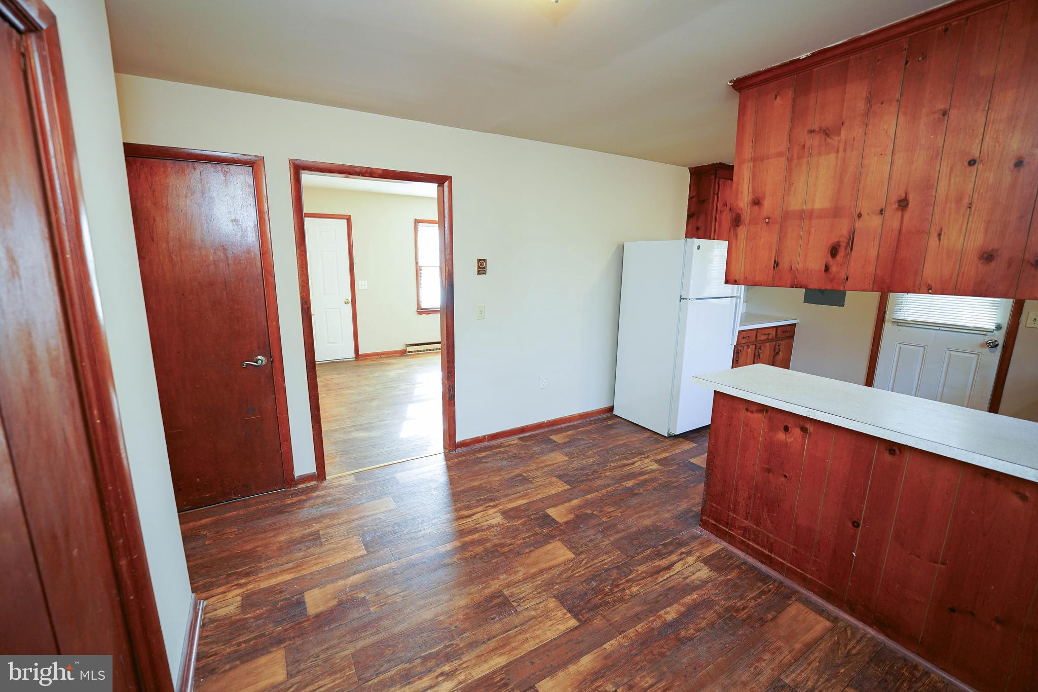 5746 Rip Wil Drive Salisbury, MD 21804 - Photo 13 of 35 an entryway with wooden floor and cabinet