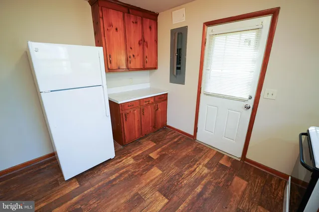 a view of front door with wooden floor