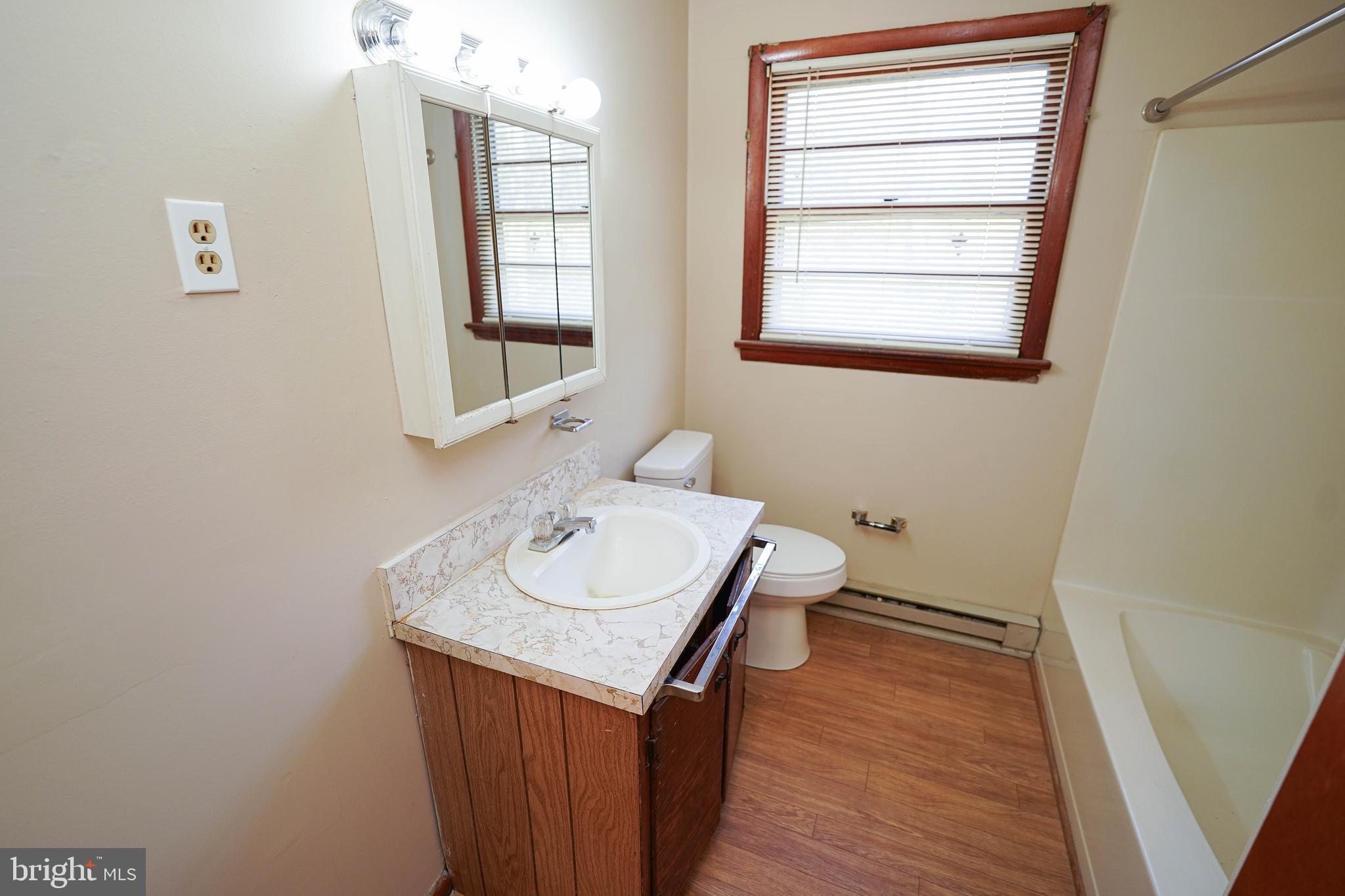 5746 Rip Wil Drive Salisbury, MD 21804 - Photo 25 of 35 a bathroom with a sink and a mirror
