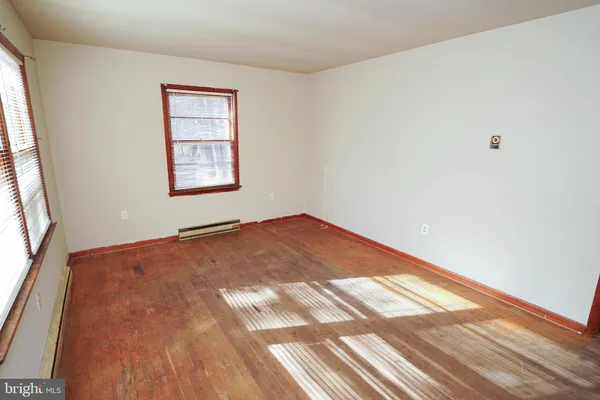 an empty room with windows