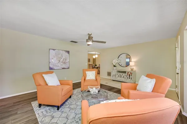 a view of a work space with furniture and a large window