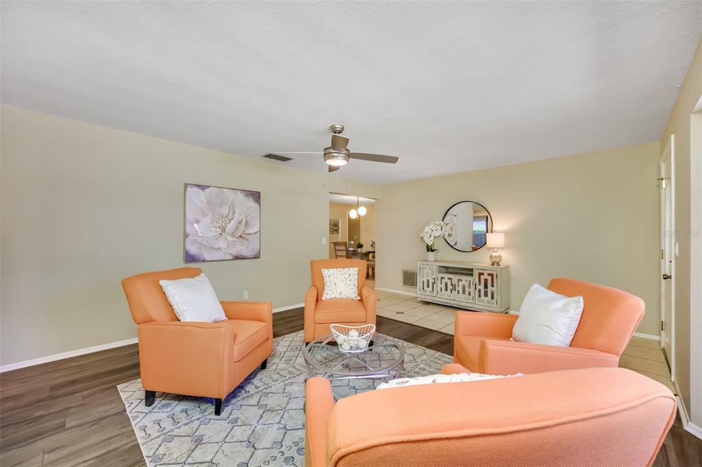 11290 142nd Street North Largo, FL 33774 - Photo 14 of 90 a living room with furniture and wooden floor
