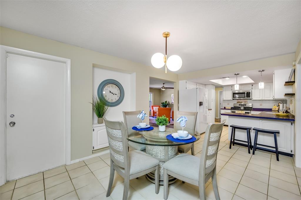 11290 142nd Street North Largo, FL 33774 - Photo 18 of 90 a view of a dining room and chairs