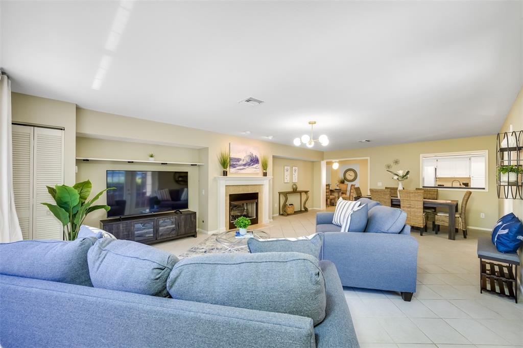 11290 142nd Street North Largo, FL 33774 - Photo 28 of 90 a living room with fireplace furniture and a flat screen tv