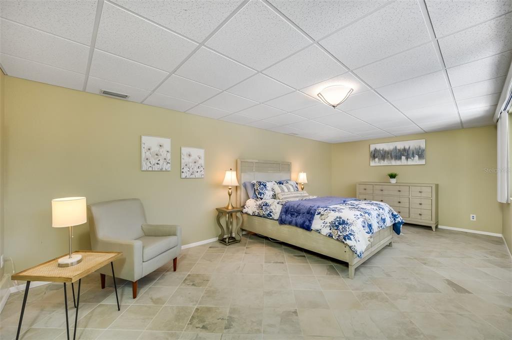 11290 142nd Street North Largo, FL 33774 - Photo 30 of 90 a bedroom with a bed and a couch