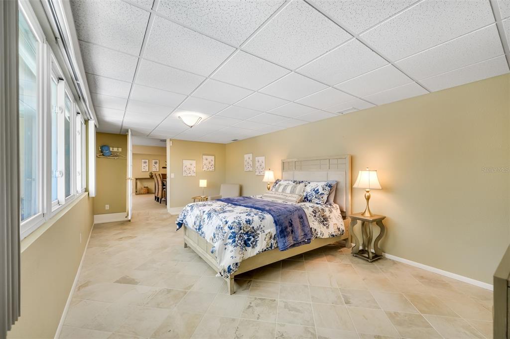 11290 142nd Street North Largo, FL 33774 - Photo 32 of 90 a bedroom with a bed and a window