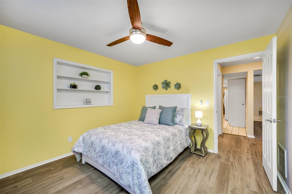 11290 142nd Street North Largo, FL 33774 - Photo 46 of 90 a bedroom with a bed and a table