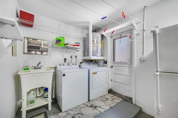 an aerial view of multiple houses with yard