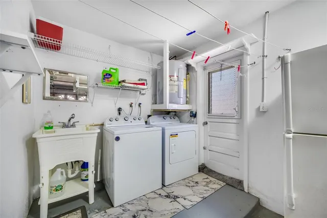 an aerial view of multiple houses with yard