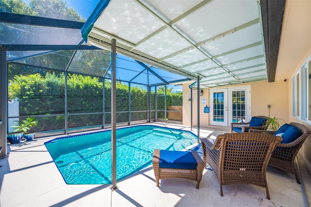 11290 142nd Street North Largo, FL 33774 - Photo 6 of 90 a view of a patio with a table and chairs