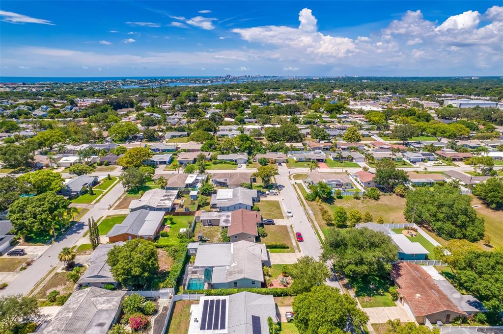 11290 142nd Street North Largo, FL 33774 - Photo 77 of 90 an aerial view of residential houses with outdoor space and trees