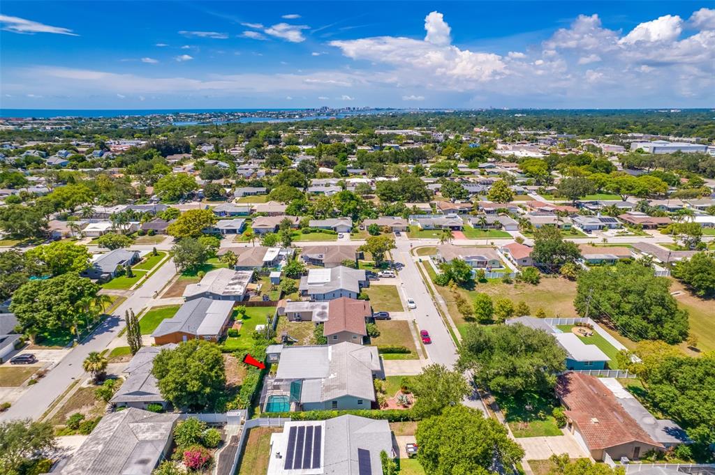 11290 142nd Street North Largo, FL 33774 - Photo 78 of 90 an aerial view of residential houses with outdoor space and trees