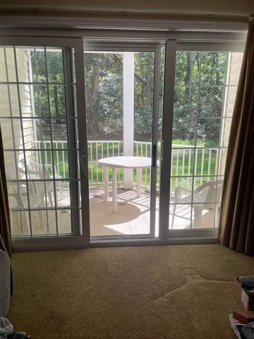 a view of empty room with floor to ceiling window