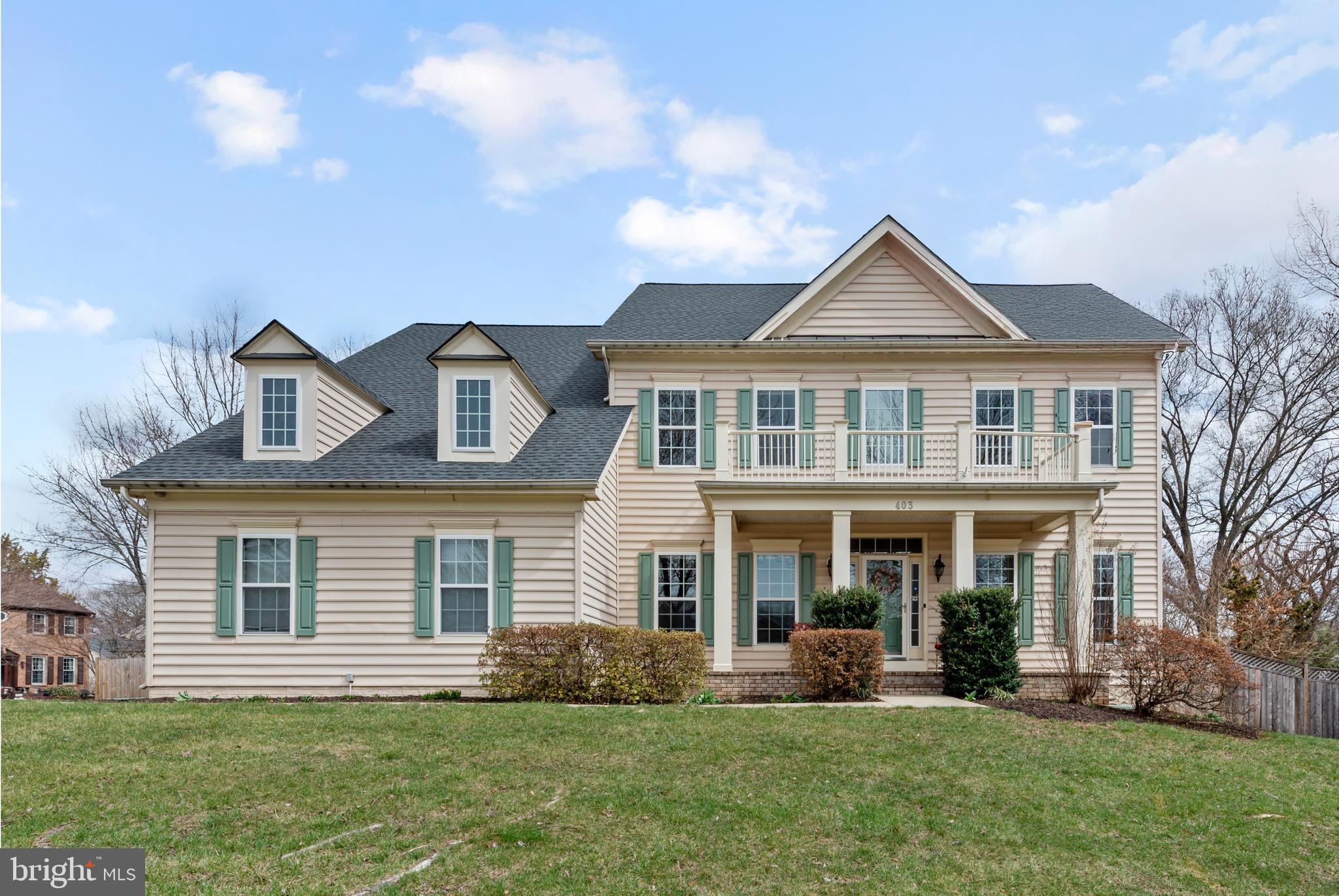 403 Madison Street Herndon, VA 20170 - Photo 1 of 63 a front view of a house with a yard