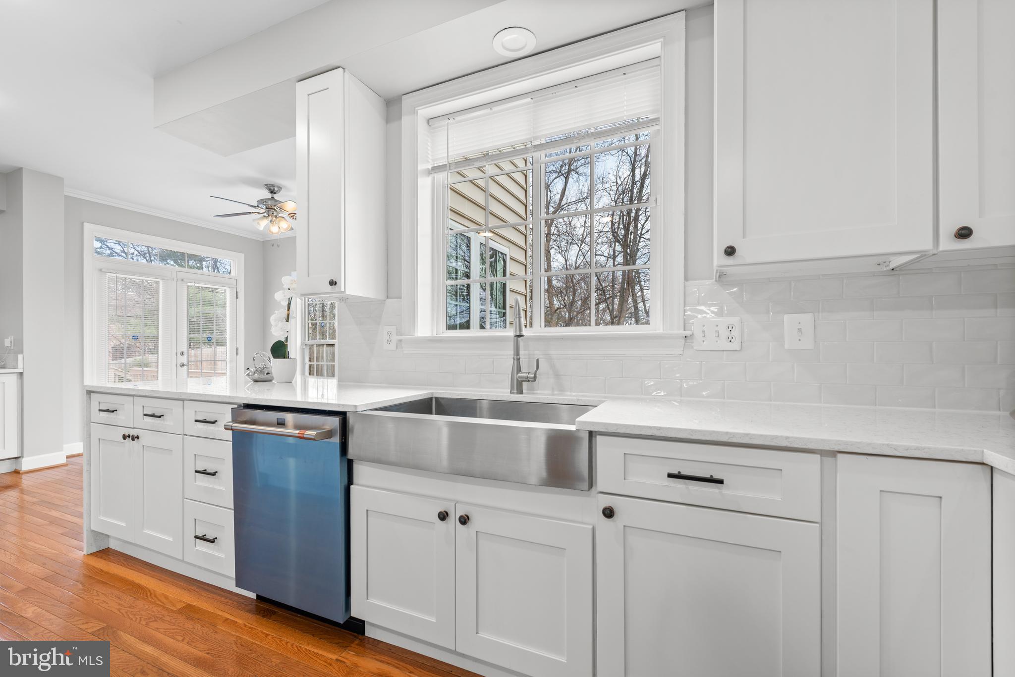 403 Madison Street Herndon, VA 20170 - Photo 11 of 63 a kitchen with white cabinets and a window