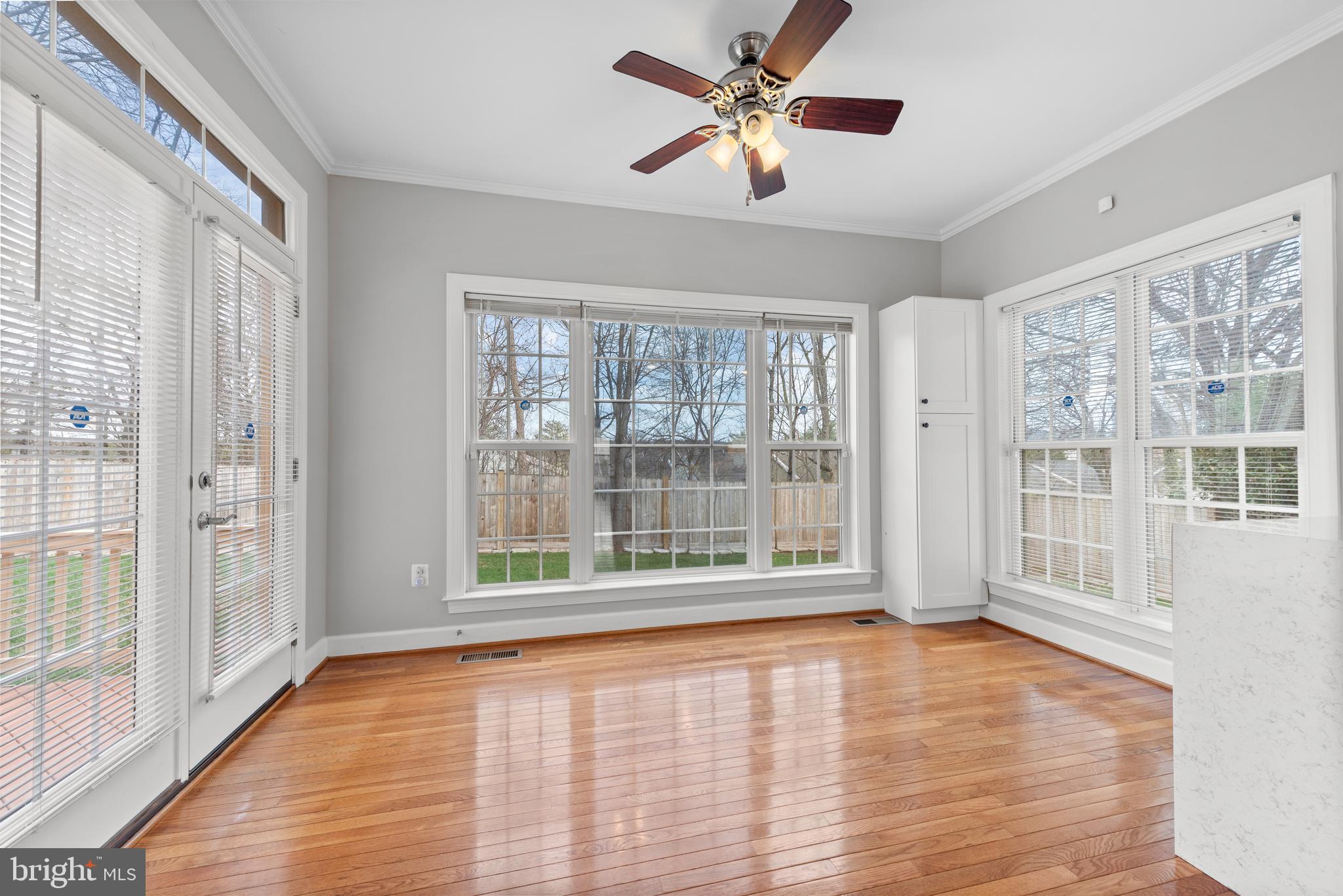 403 Madison Street Herndon, VA 20170 - Photo 16 of 63 a view of an empty room with a window and wooden floor