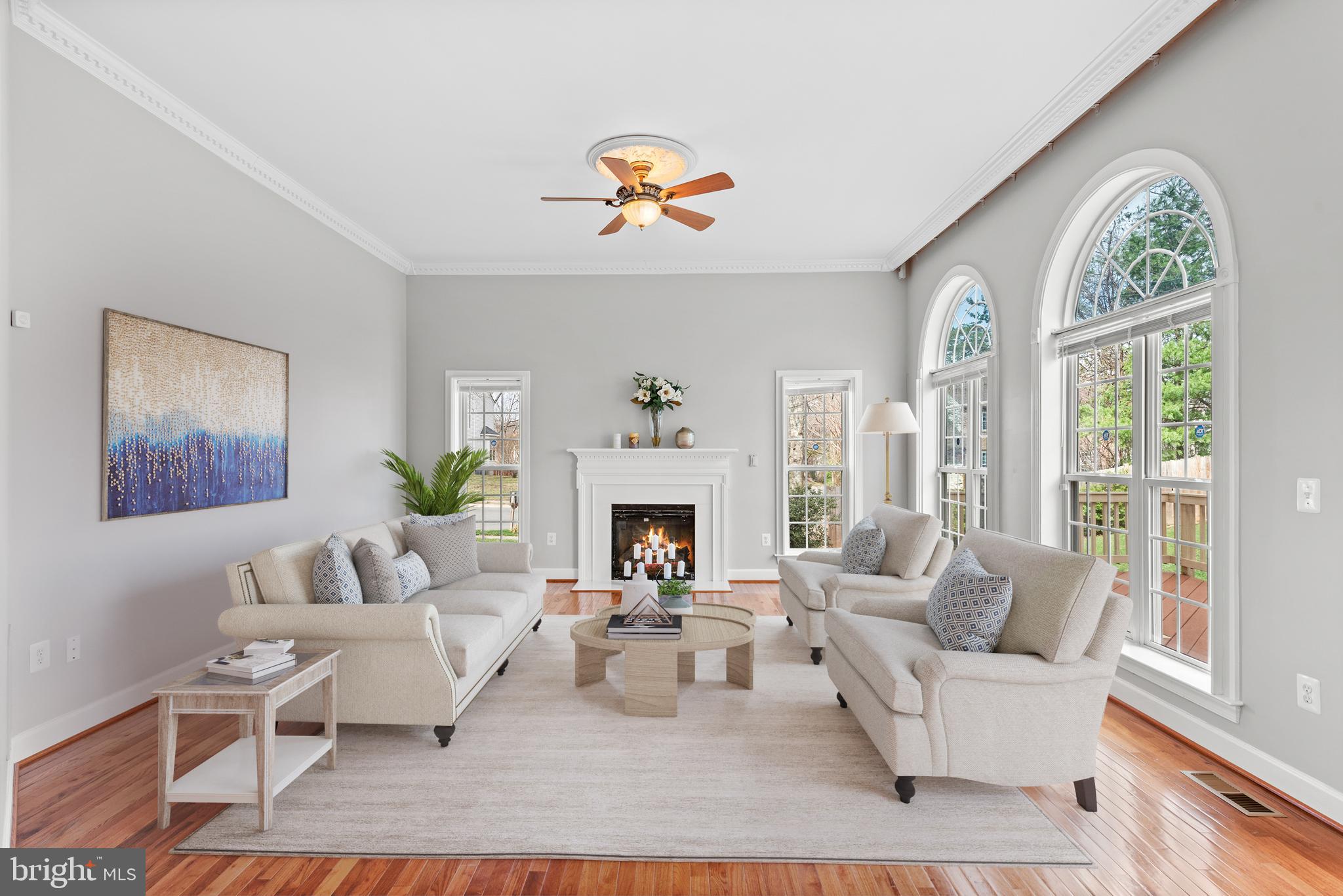 403 Madison Street Herndon, VA 20170 - Photo 17 of 63 a living room with furniture a fireplace and a large window