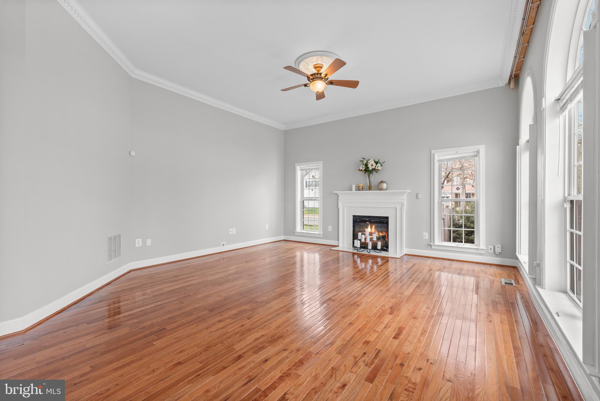 403 Madison Street Herndon, VA 20170 - Photo 19 of 63 a view of an empty room with wooden floor fireplace and a window