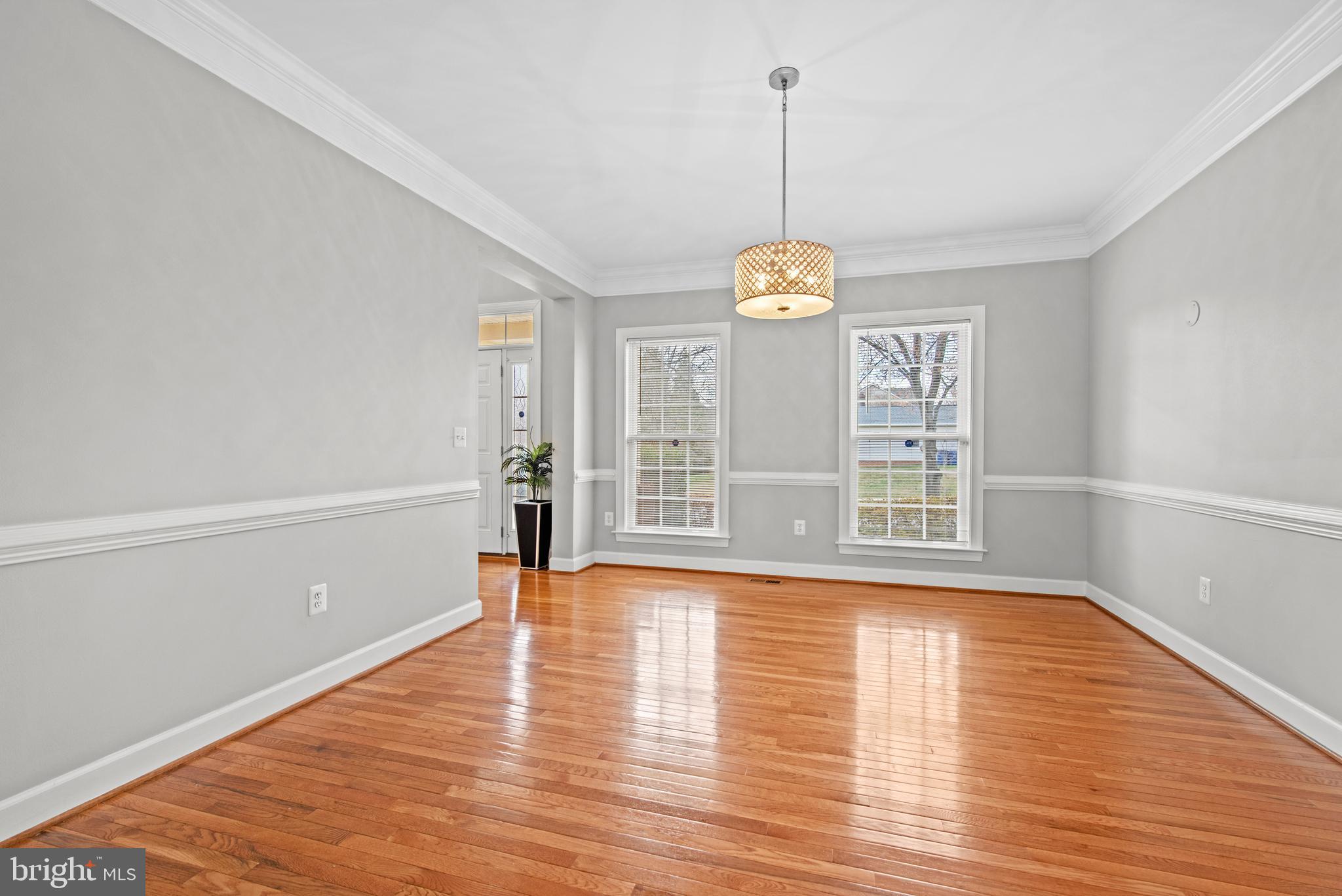 403 Madison Street Herndon, VA 20170 - Photo 23 of 63 a view of an empty room with window and wooden floor