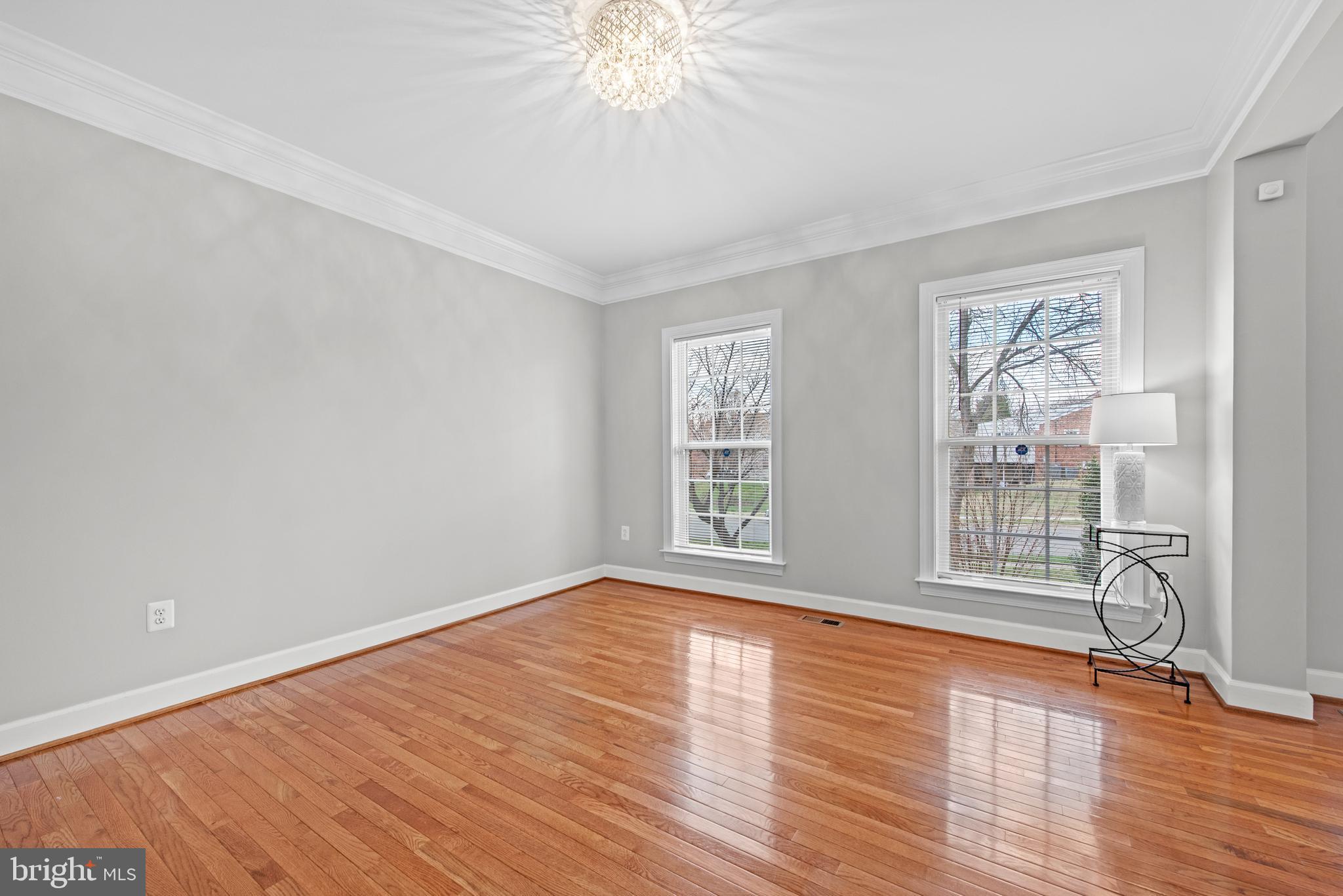 403 Madison Street Herndon, VA 20170 - Photo 25 of 63 a view of an empty room with wooden floor and a window