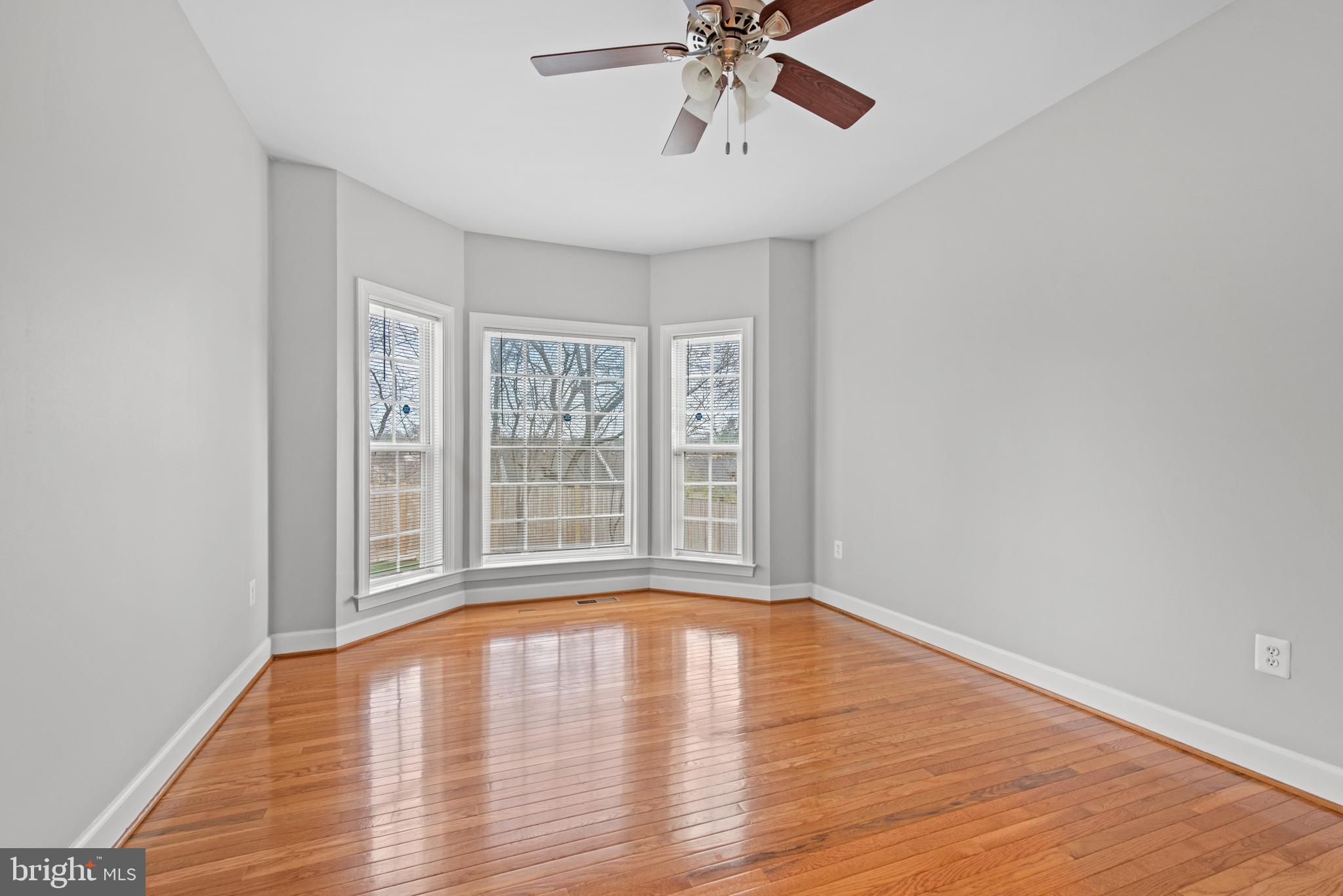 403 Madison Street Herndon, VA 20170 - Photo 29 of 63 a view of empty room with wooden floor and fan