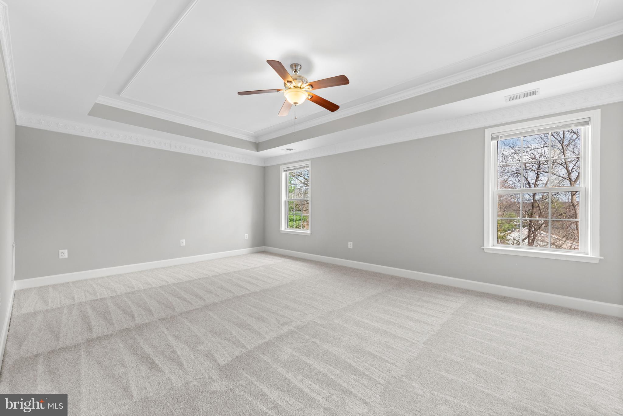 403 Madison Street Herndon, VA 20170 - Photo 37 of 63 a view of an empty room with window and a ceiling fan