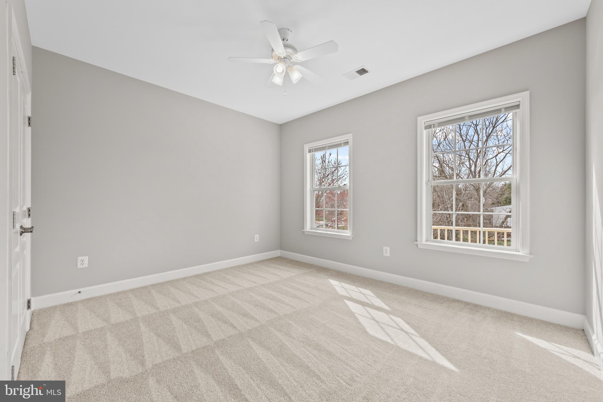 403 Madison Street Herndon, VA 20170 - Photo 44 of 63 an empty room with windows and ceiling fan