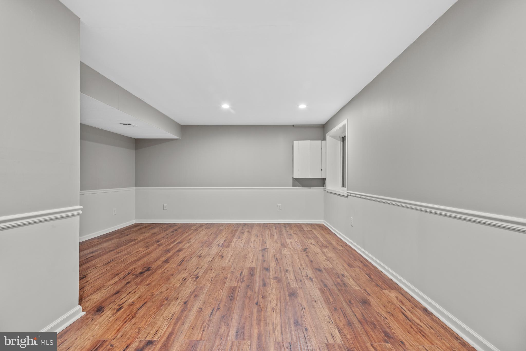 403 Madison Street Herndon, VA 20170 - Photo 57 of 63 a view of a room with wooden floor and white walls