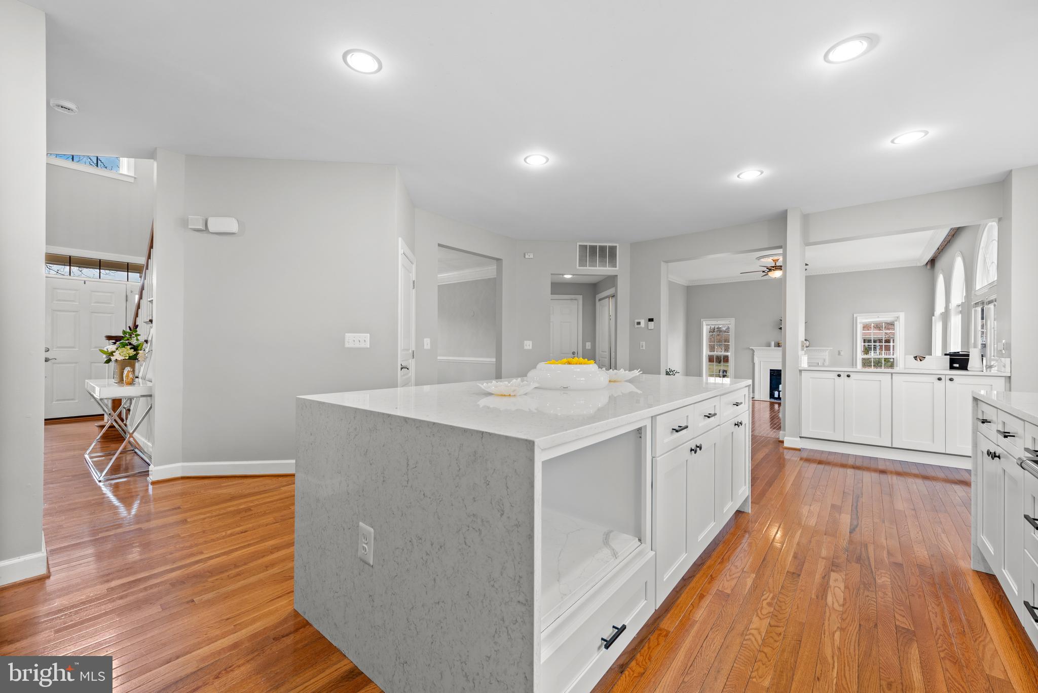 403 Madison Street Herndon, VA 20170 - Photo 7 of 63 a large kitchen with wooden floor and a sink