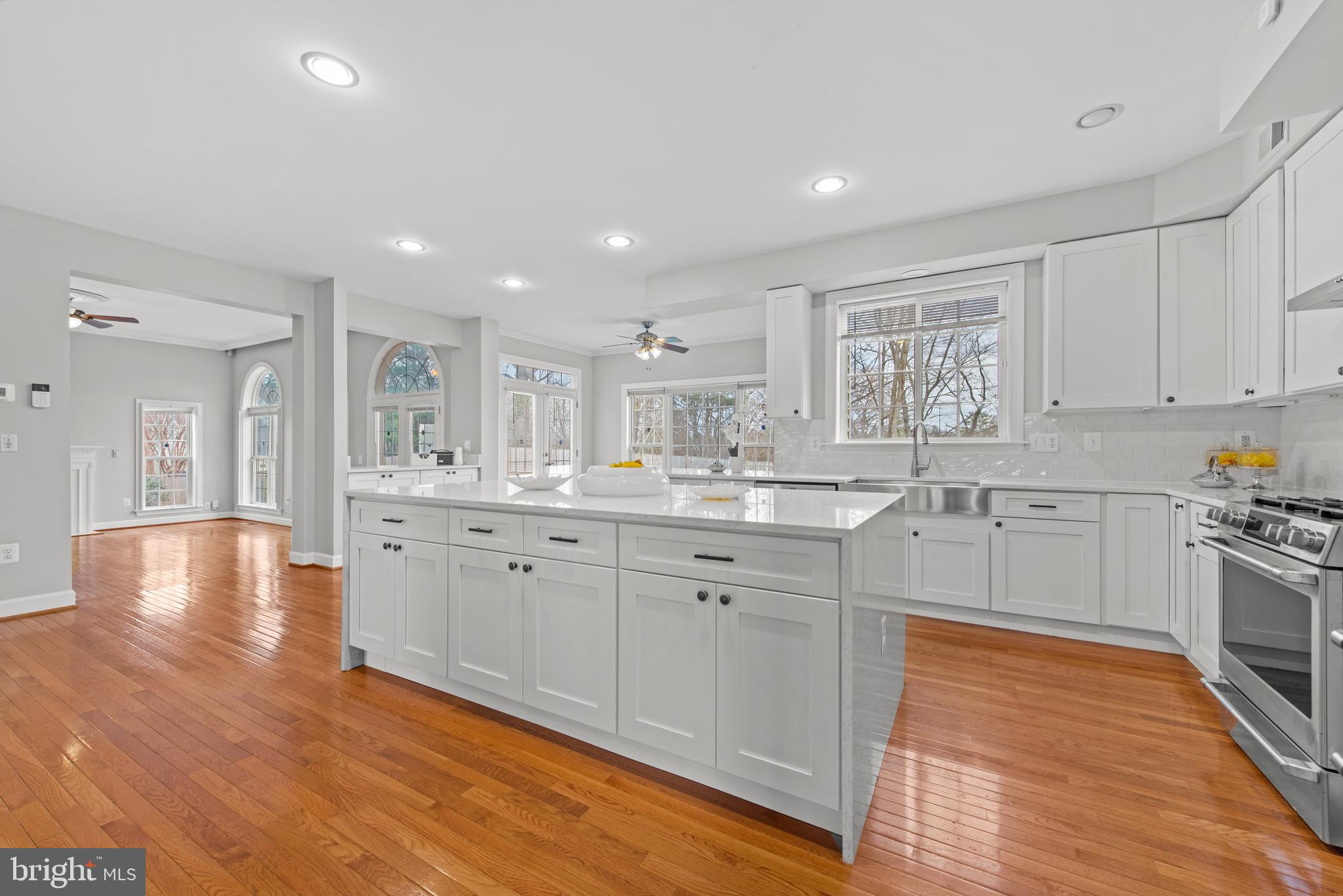 403 Madison Street Herndon, VA 20170 - Photo 8 of 63 a large kitchen with stainless steel appliances granite countertop a large center island and a wooden floors