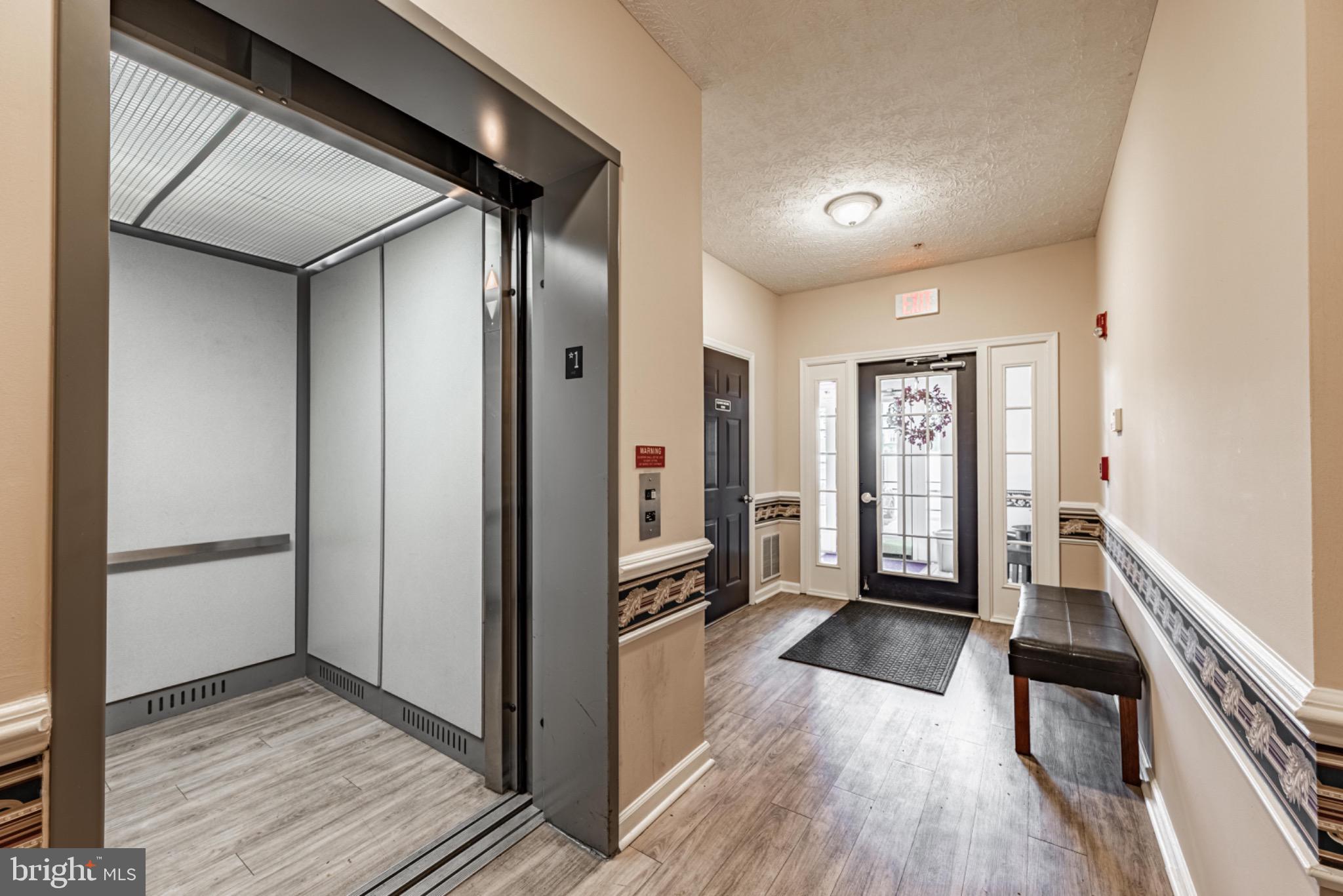 5032 Brightleaf Court, Unit 5032 Rosedale, MD 21237 - Photo 3 of 18 Inviting entrance with convenient elevator access.