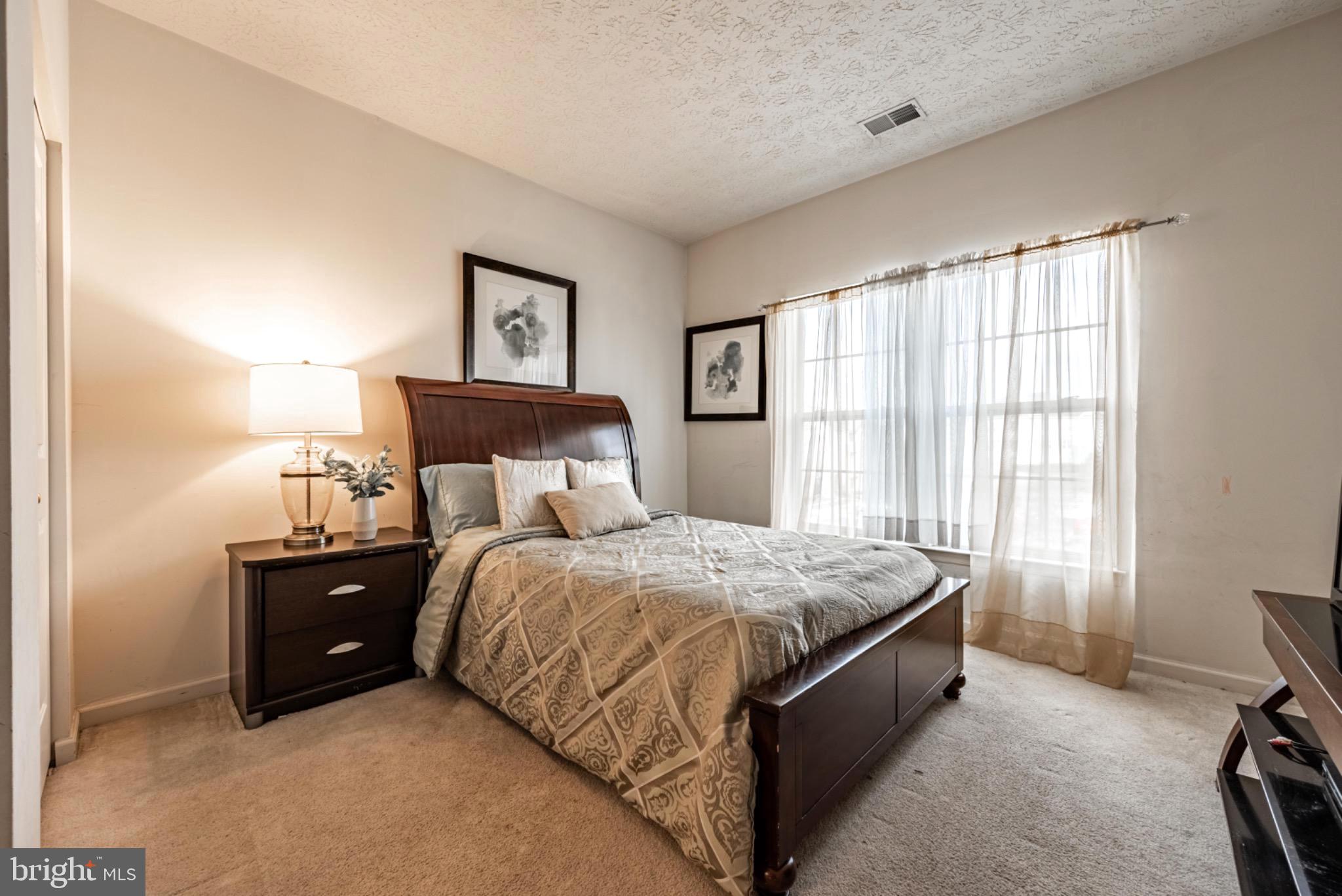 5032 Brightleaf Court, Unit 5032 Rosedale, MD 21237 - Photo 9 of 18 Cozy bedroom with natural light.