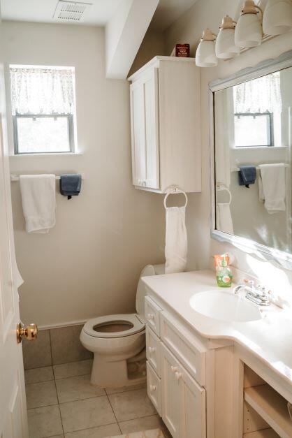 2199 Curtis Madden Road Baker, FL 32531 - Photo 49 of 63 a bathroom with a sink a toilet and window