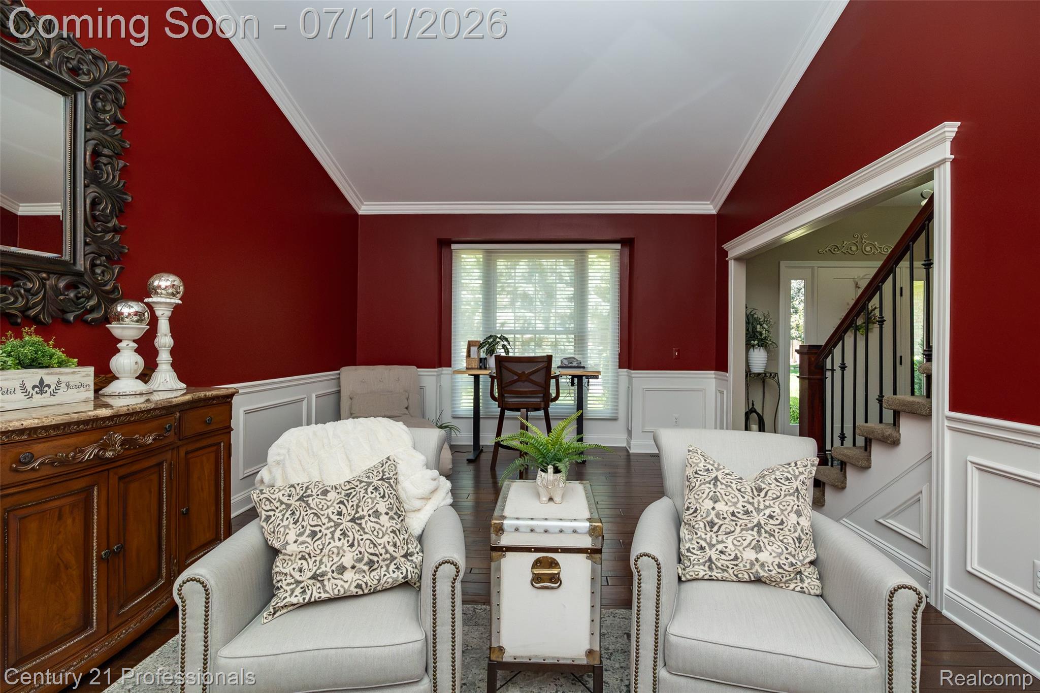 689 Woodfield Way Rochester, MI 48307 - Photo 45 of 61 Formal room featuring deep red walls with white crown molding and wainscoting