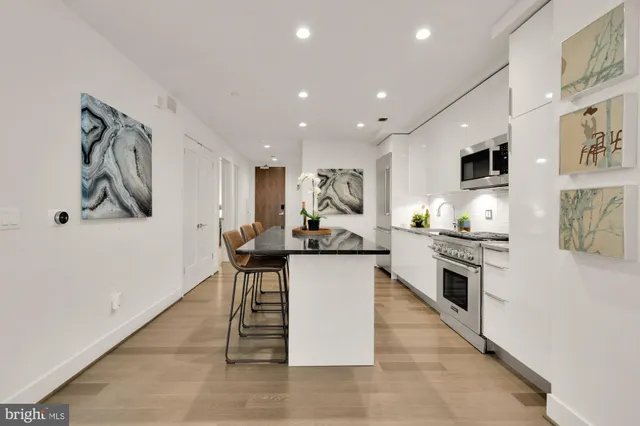 a kitchen with a sink and counter top space