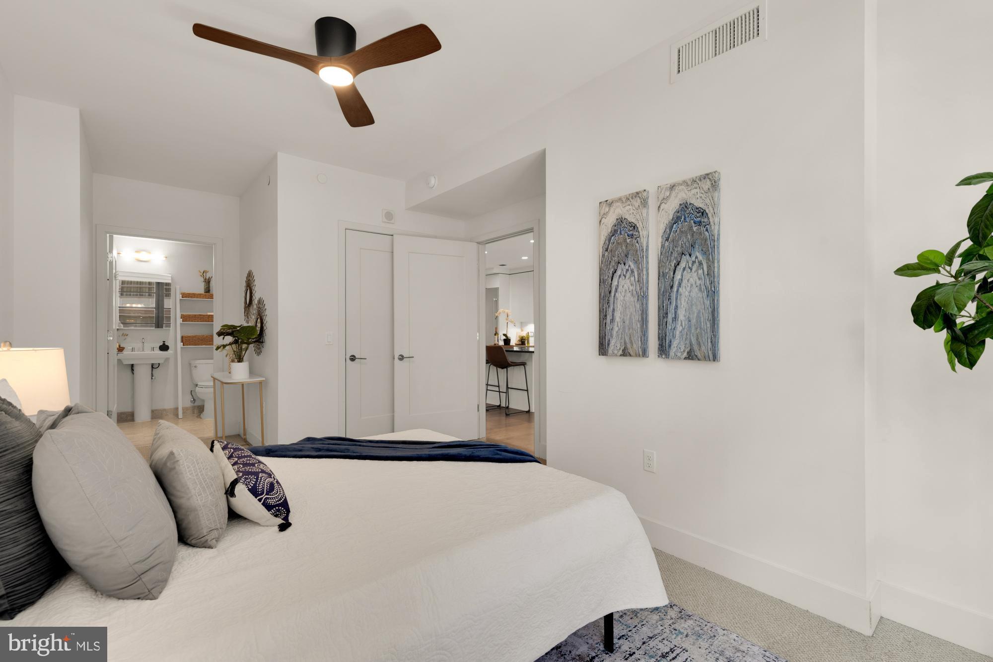 45 Sutton Square Southwest, Unit 303 Washington, DC 20024 - Photo 21 of 45 a bedroom with a bed and ceiling fan