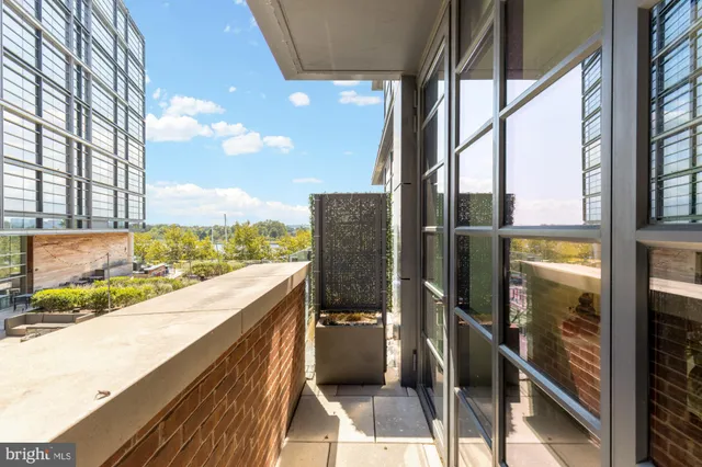 a view of balcony with wooden floor