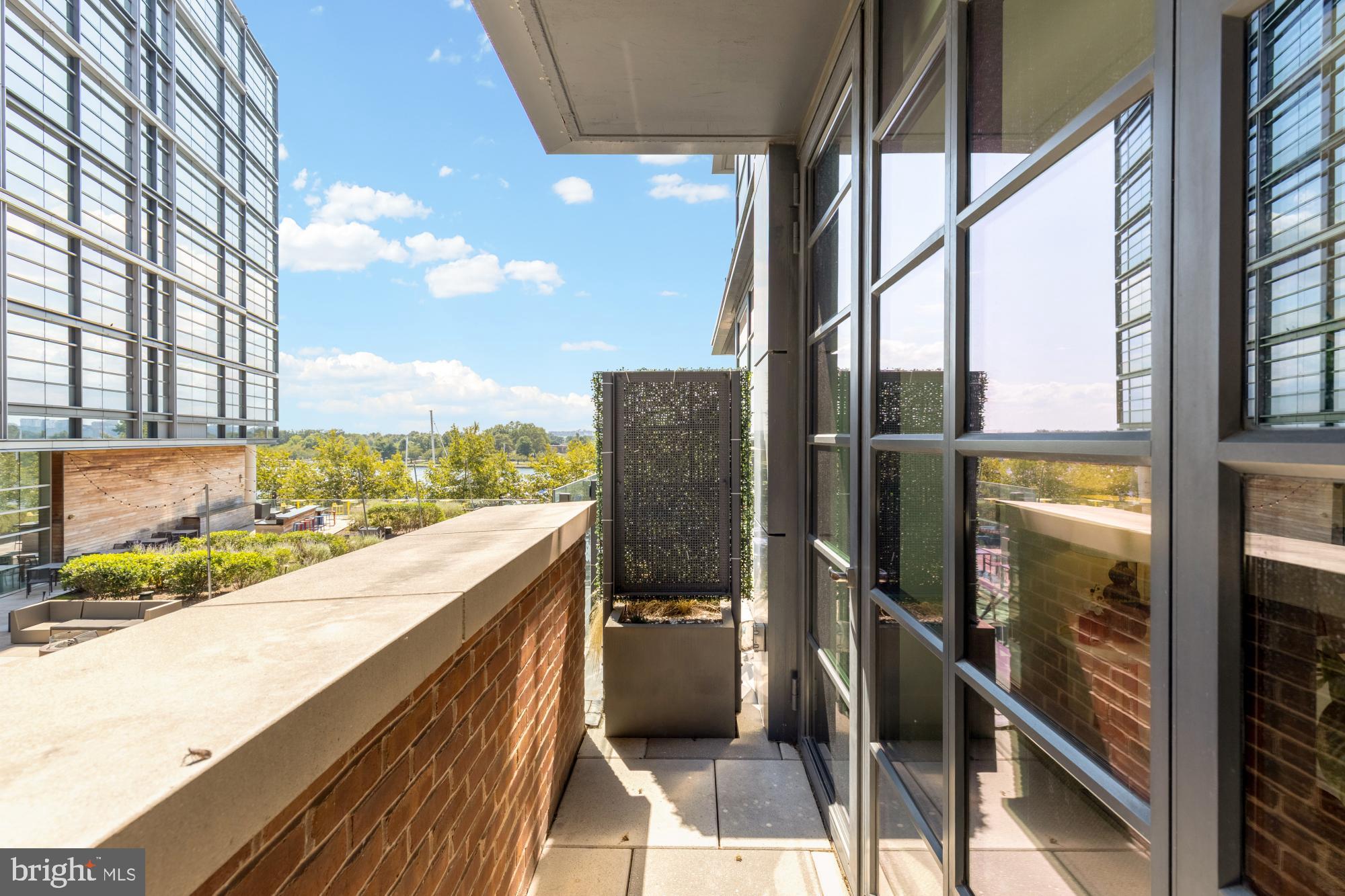 45 Sutton Square Southwest, Unit 303 Washington, DC 20024 - Photo 23 of 45 a view of balcony with wooden floor