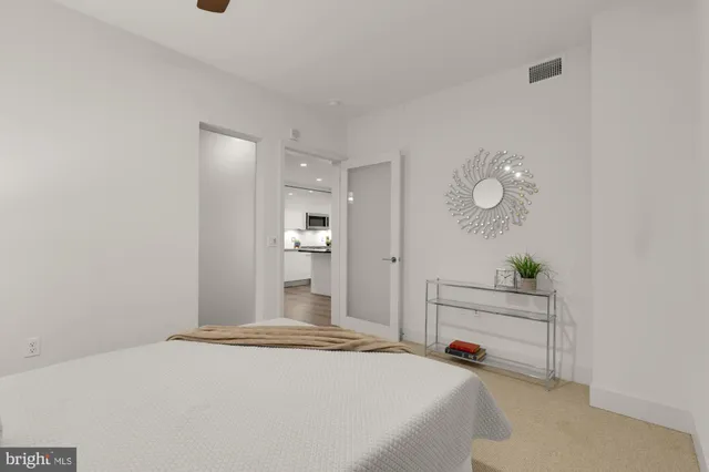 a bedroom with a bed and a cabinets