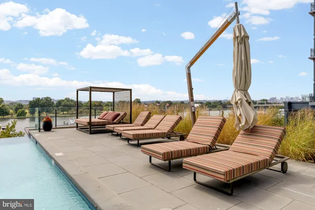 a view of a swimming pool with a chairs